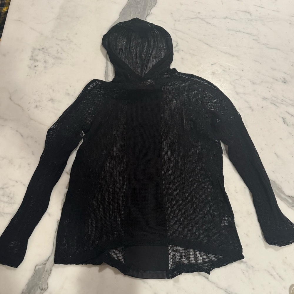 beachy black coverup, see-through, black leather stripe on the back, with hood.